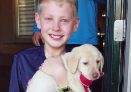 Boy and puppy. Source: YouTube screenshot
